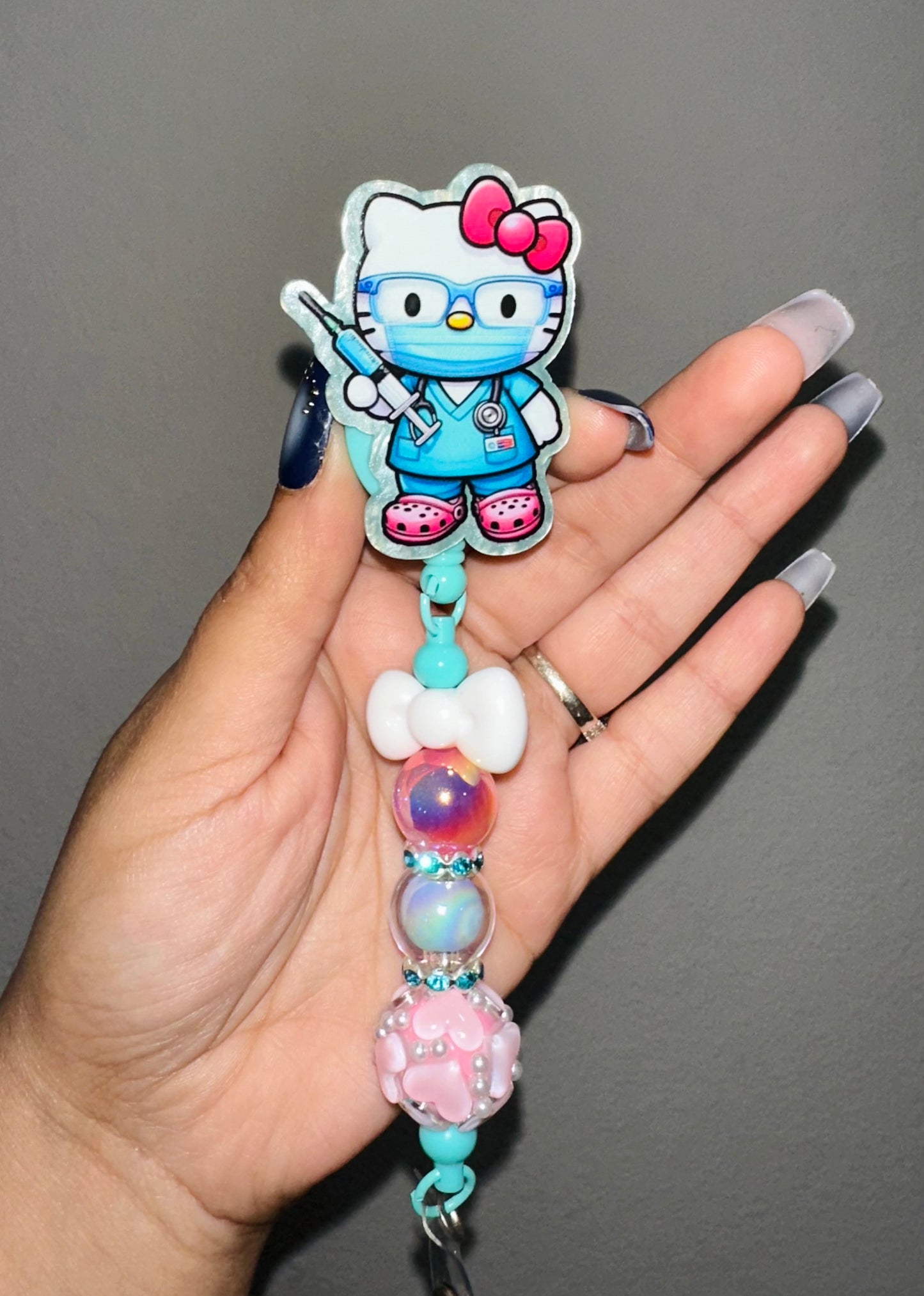 HK Teal Scrubs Badge Reel