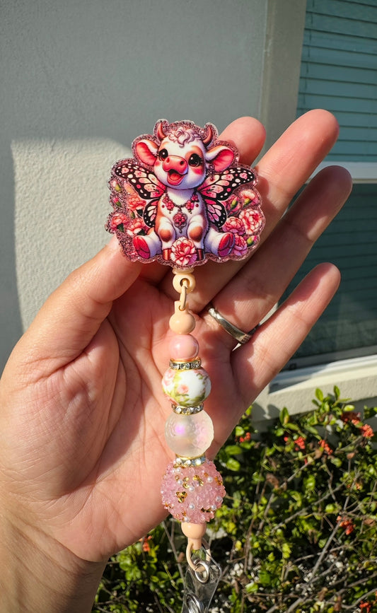 Coral Butterfly Cow Badge Reel